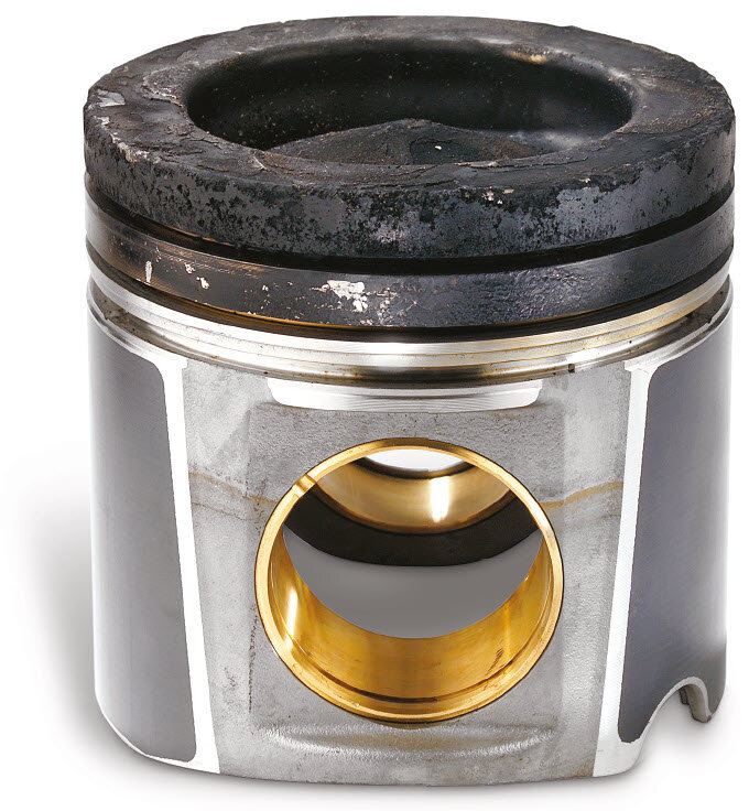 Fig. 3 (click to enlarge) Cylinder and cylinder liner - wear damage: Hard oil coating on the fire bridge of the piston| Kolbenschmidt | Motorservice